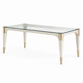 Table à manger contemporaine Faverino, 180x100 cm en verre et bois blanc avec détails dorés, design élégant et moderne.
